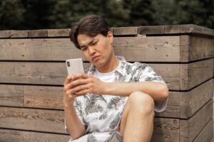 Someone's checking his phone because of FOMO